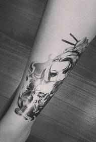 skull and the beautiful woman's leg tattoo picture