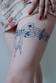 beauty leg notes bow tattoo