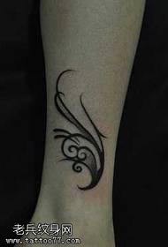 Beautiful totem tattoo pattern on the legs