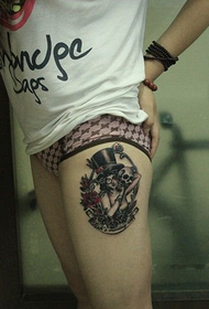 girl skull thigh tattoo