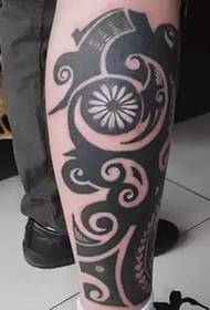 Mysterious totem leg tattoo
