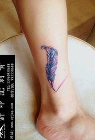 Leg feather tattoo