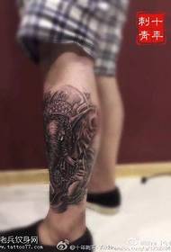 Idol tattoo on the calf