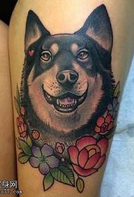 Cute dog tattoo on the thigh