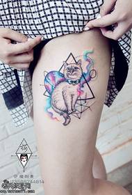 Cat tattoo pattern with geometric elements on the thigh