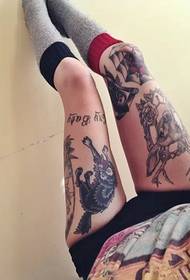 Beautiful tattoo with sexy long legs