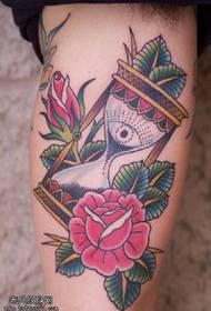 I-Thigh rose hourglass tattoo iphethini