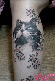 Cat and small flower tattoo picture on calf