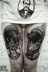 Abstract art tattoo pattern on thigh