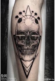 Calf geometric element skull tattoo pattern