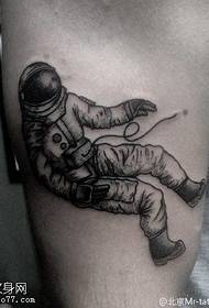 Spaceman tattoo pattern on the thigh