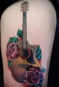 Guitar tattoo listening to the world