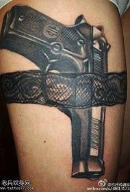 Realistic little pistol tattoo pattern