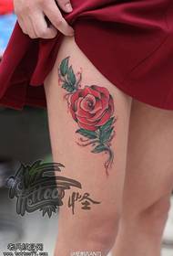 Female legs school colored rose tattoo pattern