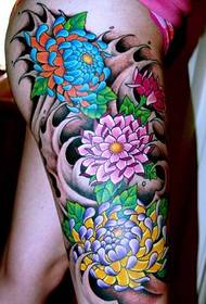 Picture of leg colored peony tattoos