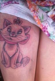 Kitten tattoo picture on girl's thigh