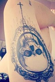 Female thigh fashion skull tattoo