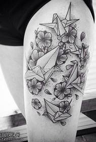Female legs, paper crane, tattoo pattern