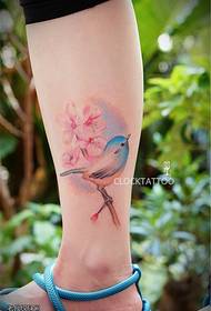 Female legs, colorful flowers and birds, tattoo pattern