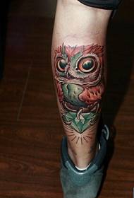 a colorful owl tattoo pattern on the leg