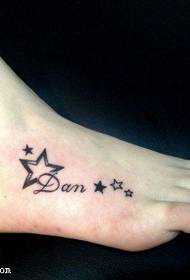Small fresh five-pointed star tattoo on the instep