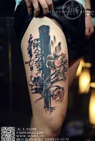 Girl thigh flower calligraphy tattoo