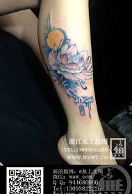 Girl's leg lotus tattoo