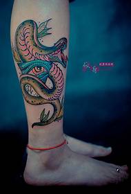 Borjú kobra és Isten szem tetoválás képe