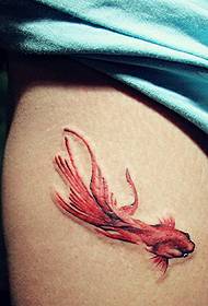 a colorful goldfish tattoo pattern on the leg