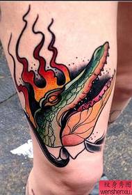 Leg domineering crocodile tattoo works