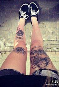 a woman's leg tattoo pattern