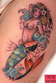 Woman legs mermaid tattoos