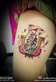 Woman legs color sailboat tattoo work