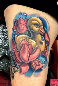 a creative duck tattoo in the leg