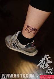 a cute little elephant tattoo on the foot