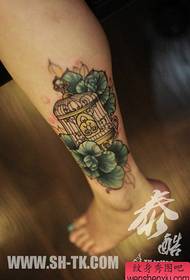 Beautiful girl's legs are popular with birdcage tattoos