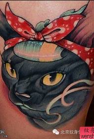 Leg color bow cat tattoo work by tattoo