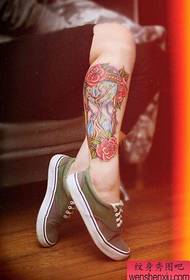 a woman's leg colored hourglass tattoo pattern