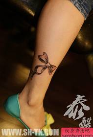 Girls' small, black and white bow tattoos