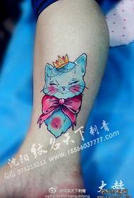 Girls' legs can be seen with cats and bow tattoos