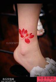 Woman's leg color lotus tattoo picture shared by the tattoo hall
