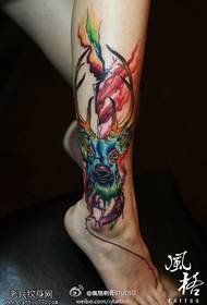 Leg color splashing antelope tattoo work
