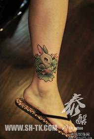 A little rabbit tattoo pattern with a cute girl's leg