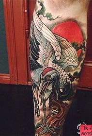 A creative legged white crane tattoo work