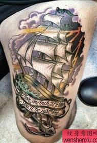 A cool and popular sailing tattoo on the leg