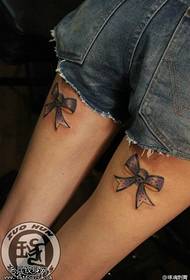Female legs bow tattoo pattern