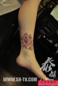 Female calf pop pop rose tattoo pattern