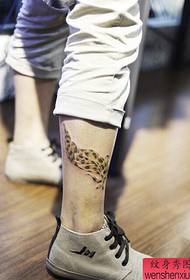 leg leopard feather tattoo tattoo works