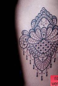 Beautiful lace tattoo pattern on the legs