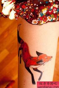 a woman's leg red fox tattoo pattern